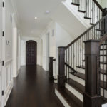 DDBuild-A new custom home white hallway and new wood staircase
